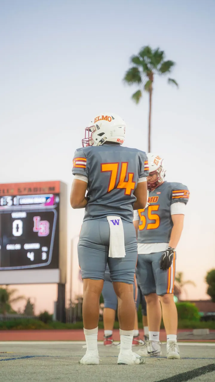 Two El Modena linemen waiting at sunset