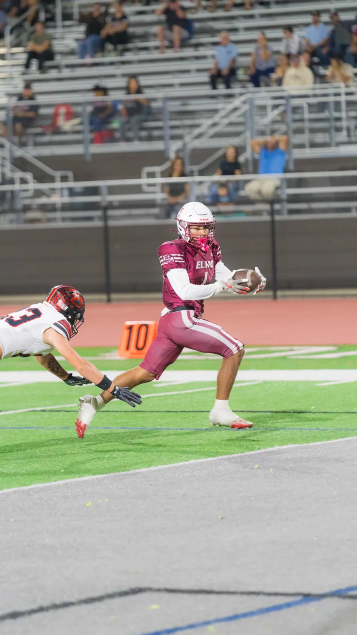 Ball carrier breaks free as a defender dives, El Modena vs. Troy